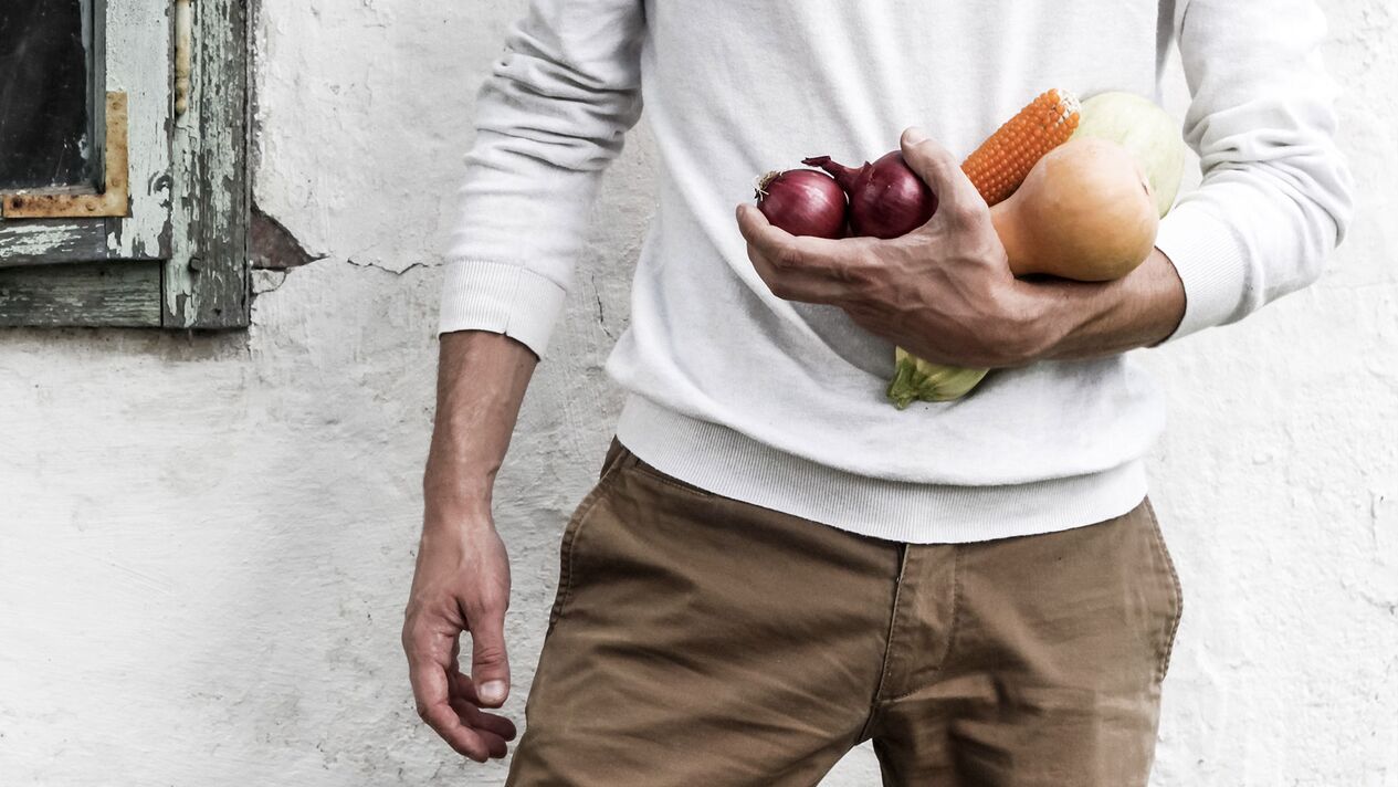 man with healthy food to increase potency